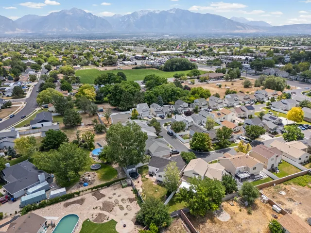Aerial perspective showcasing a residential area with diverse home styles and mature landscaping