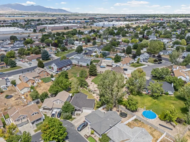 Aerial perspective showcasing a residential neighborhood with varied architectural styles and mature landscaping