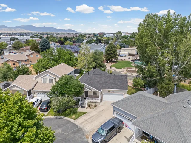 Aerial perspective showcasing a residential street with diverse home styles