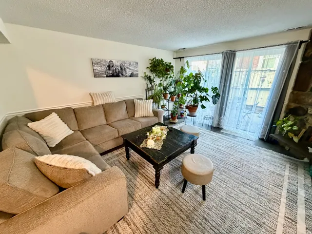 Living area featuring light-colored walls and wainscoting
