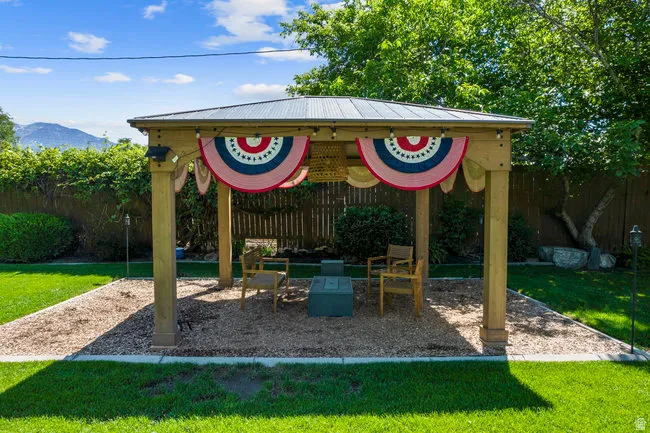Freestanding wooden gazebo with a metal roof