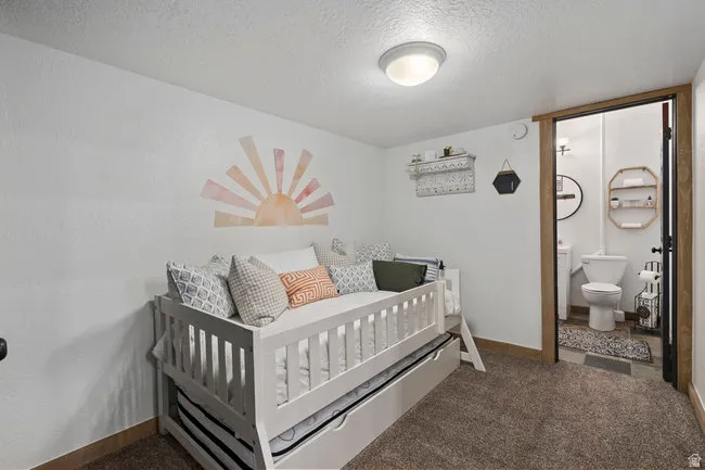Interior room with brown carpet flooring and white painted walls