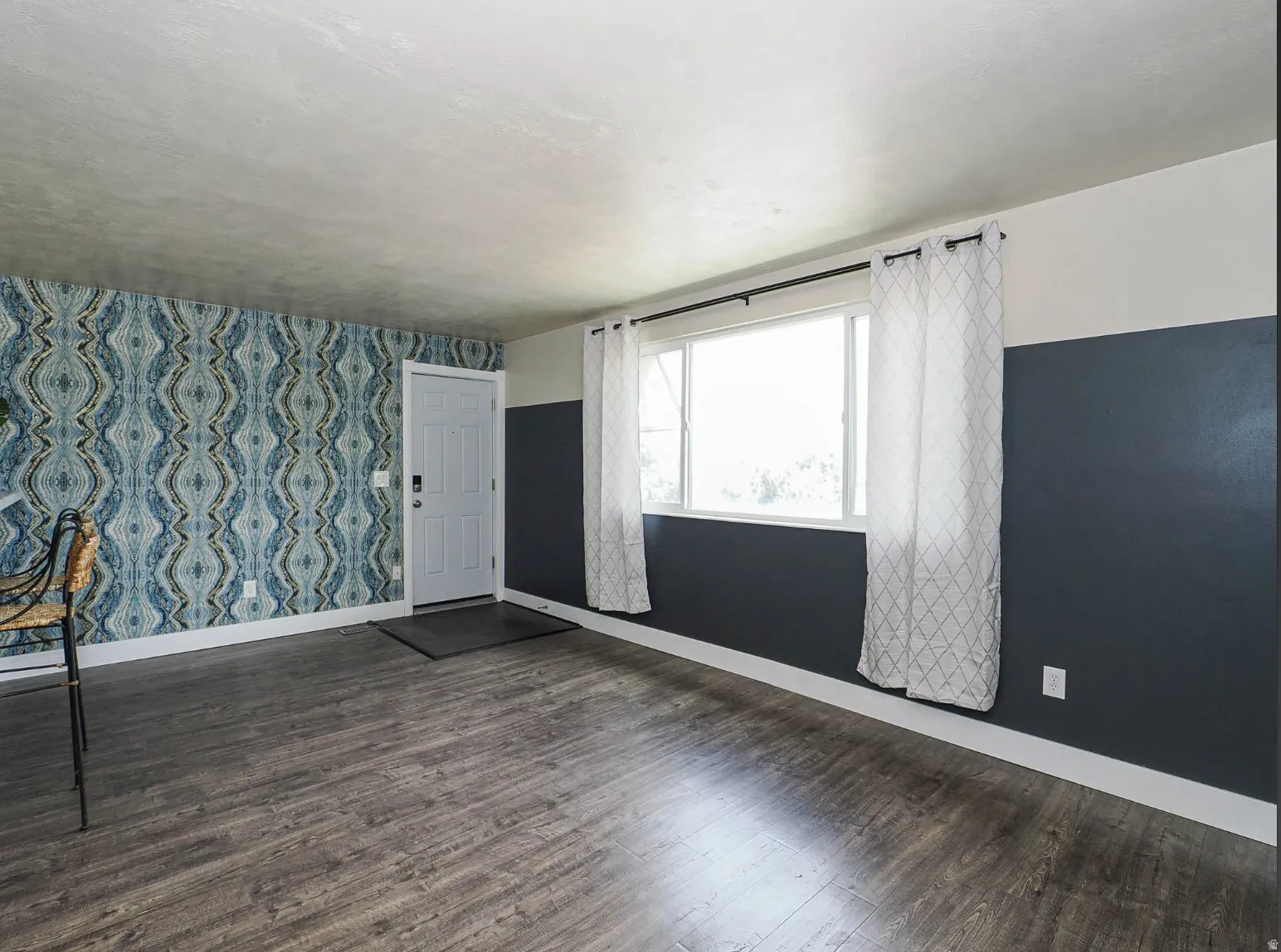 Fun wallpaper and large window in the great room