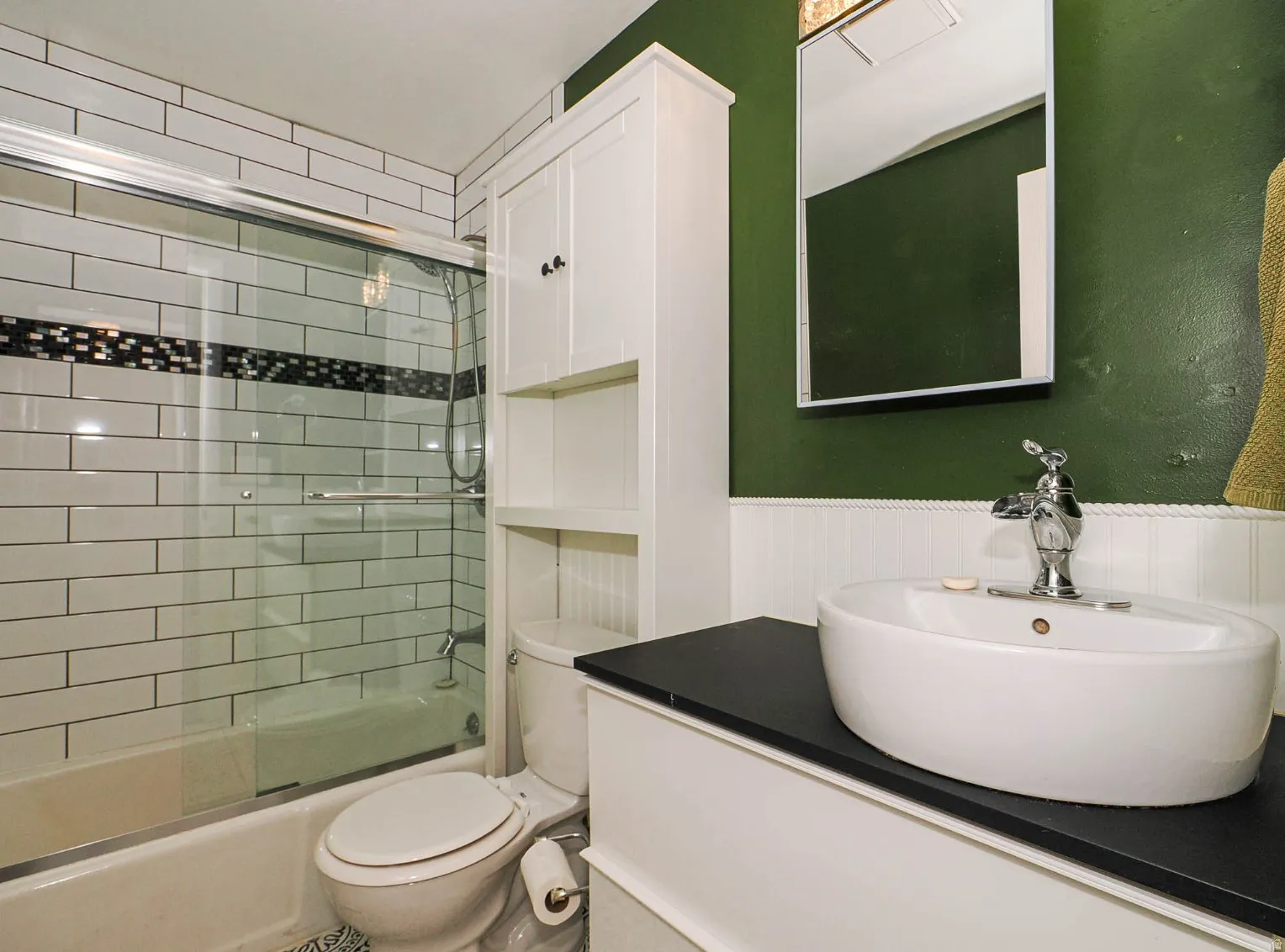 Bathroom with tub shower combo, subway tile, new vanity and tile floor