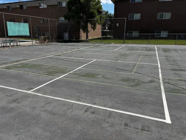 Large cement area with tennis, basketball and pickleball opportunities