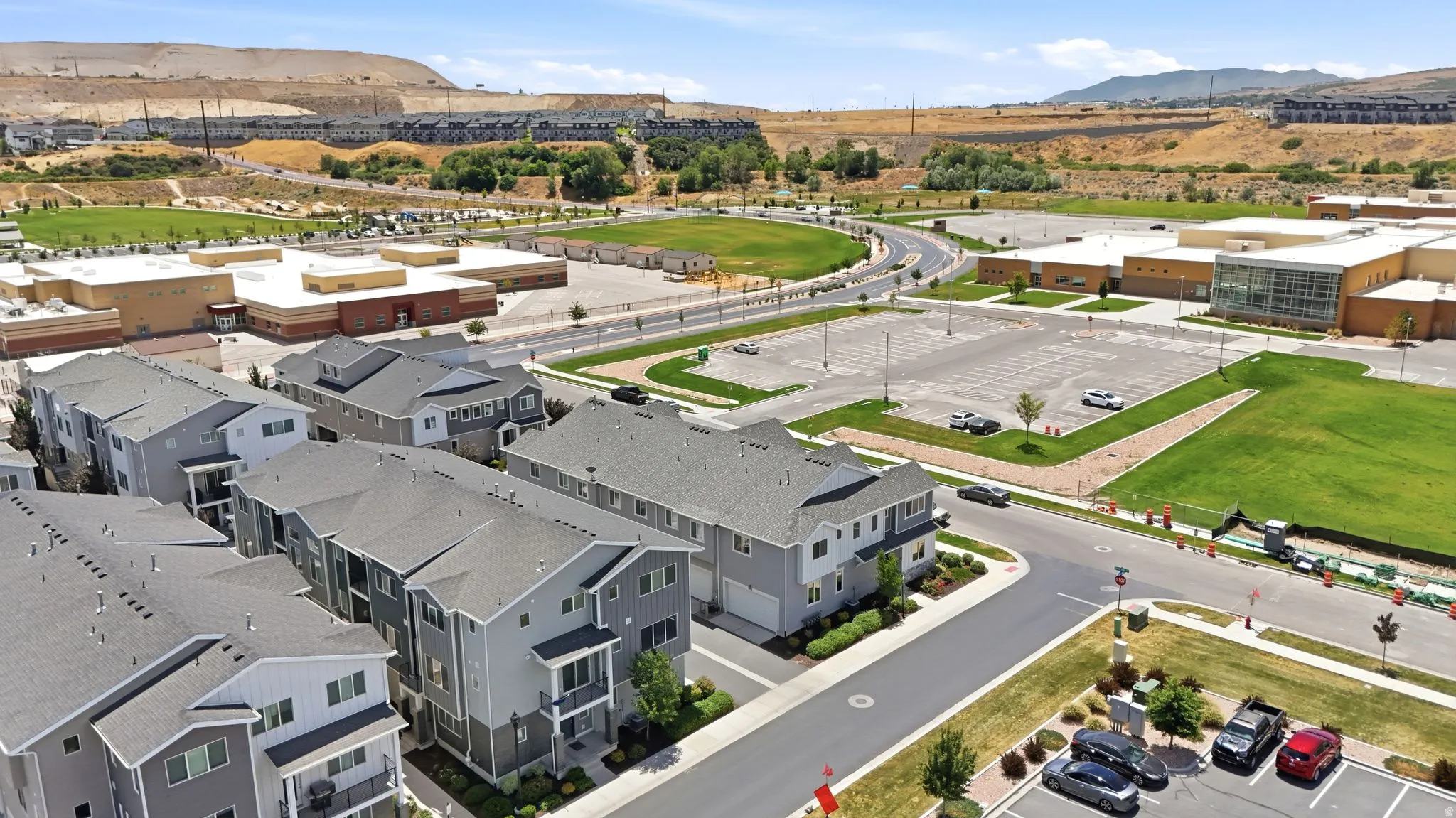 Modern townhome community featuring multi-story units with attached garages