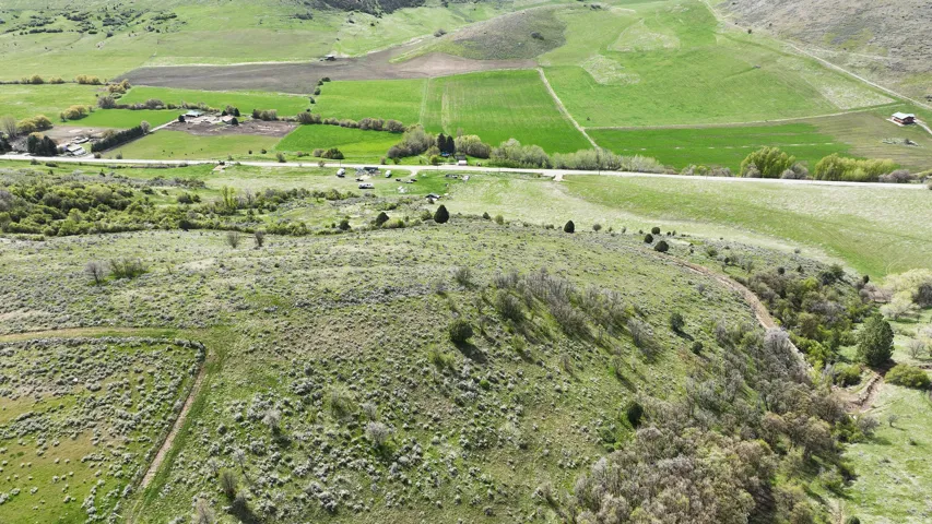 Expansive undeveloped land featuring natural terrain and varied vegetation