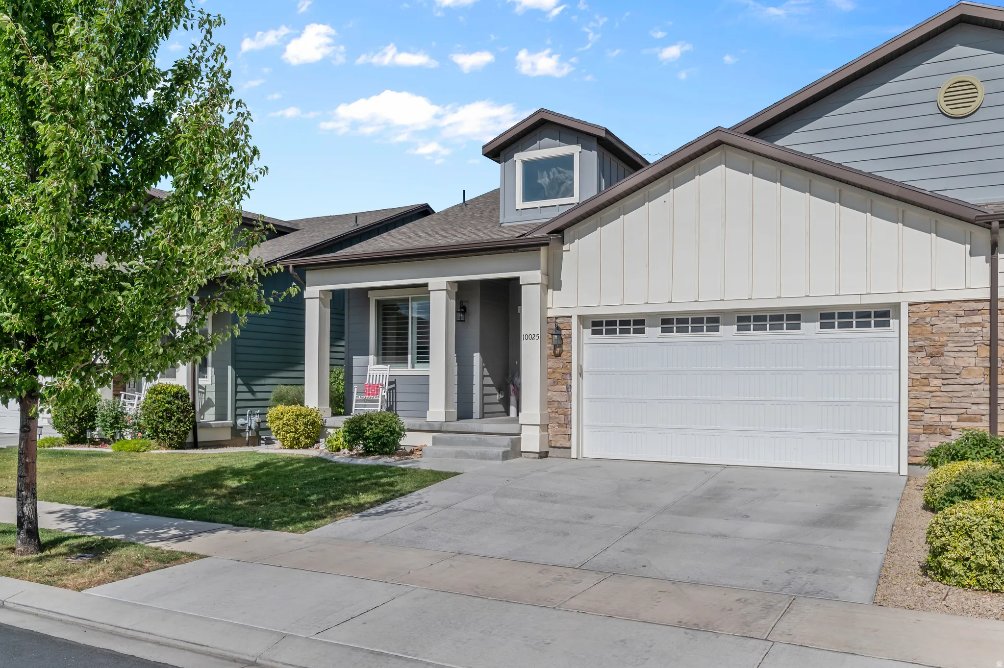 HOME EXTERIOR - FRONTContemporary facade featuring horizontal and vertical siding with stone accents