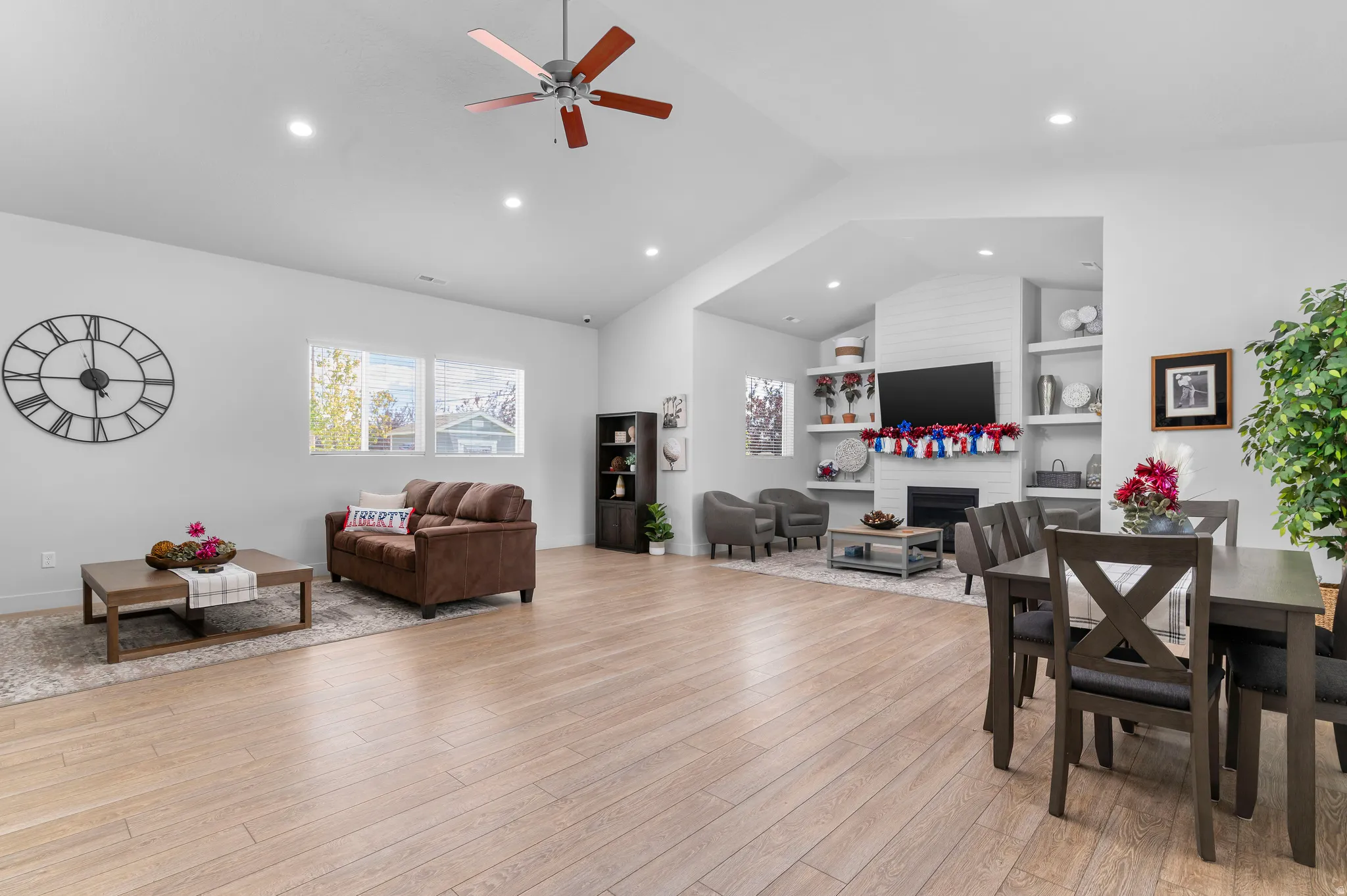 Vaulted ceiling with a ceiling fan and recessed lighting