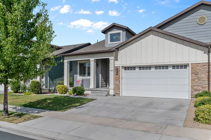 HOME EXTERIOR - FRONTContemporary facade featuring horizontal and vertical siding with stone accents