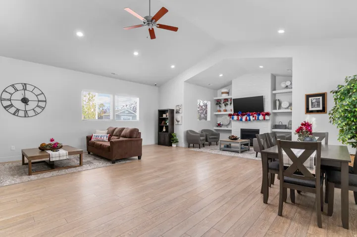 Vaulted ceiling with a ceiling fan and recessed lighting