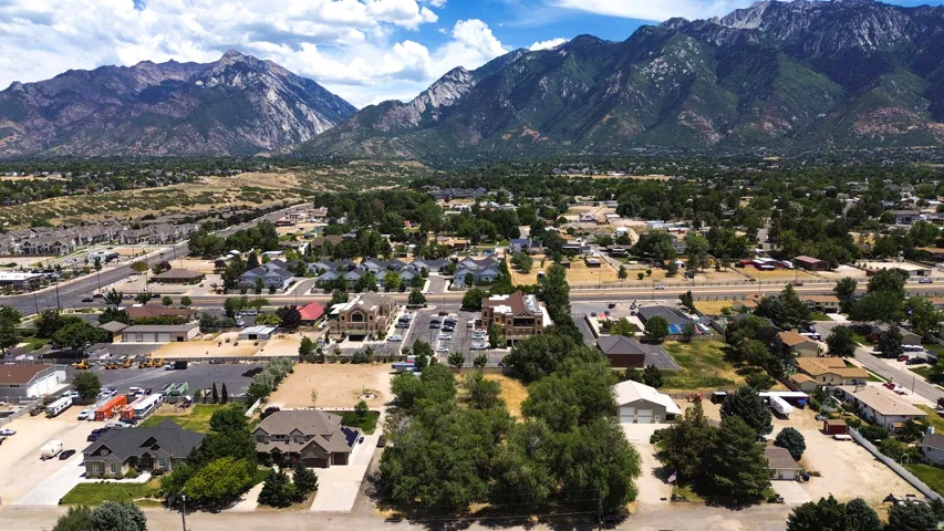 Aerial overview showcasing a residential district with mountainous terrain in the background