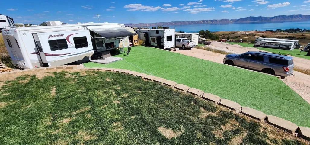 Expansive artificial turf area with a retaining wall