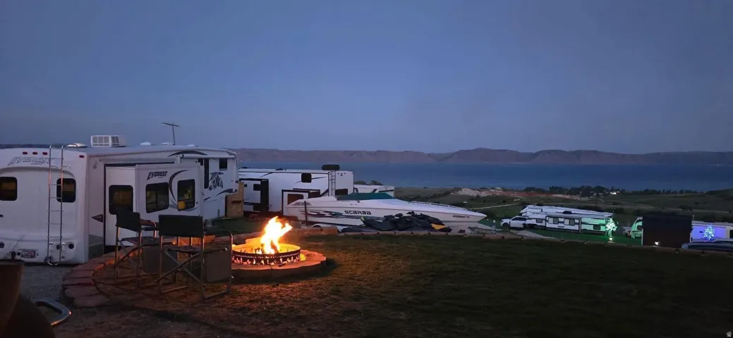 Outdoor fire pit with a stone surround