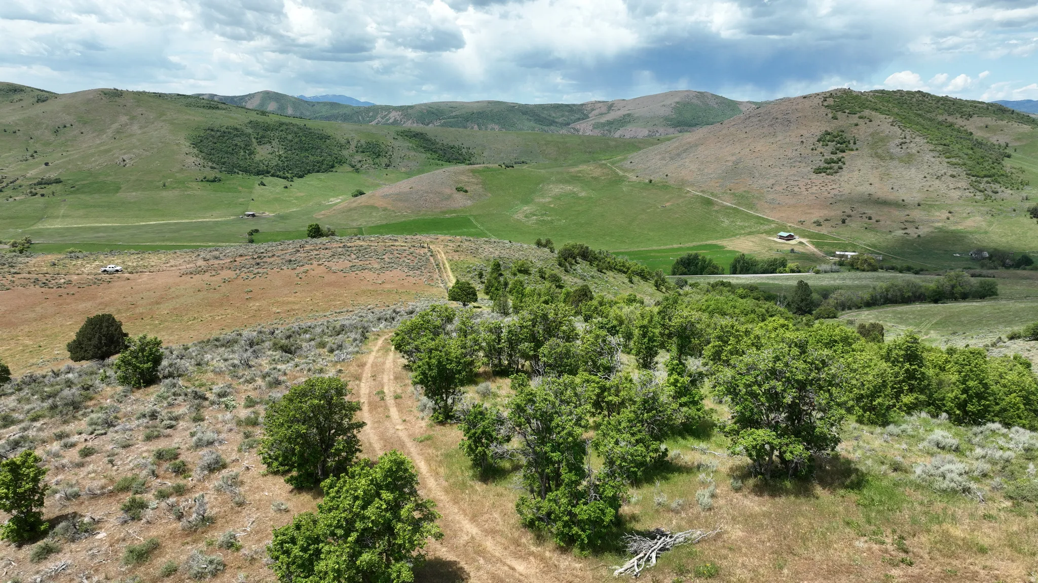 Expansive natural landscape featuring rolling hills and varied terrain