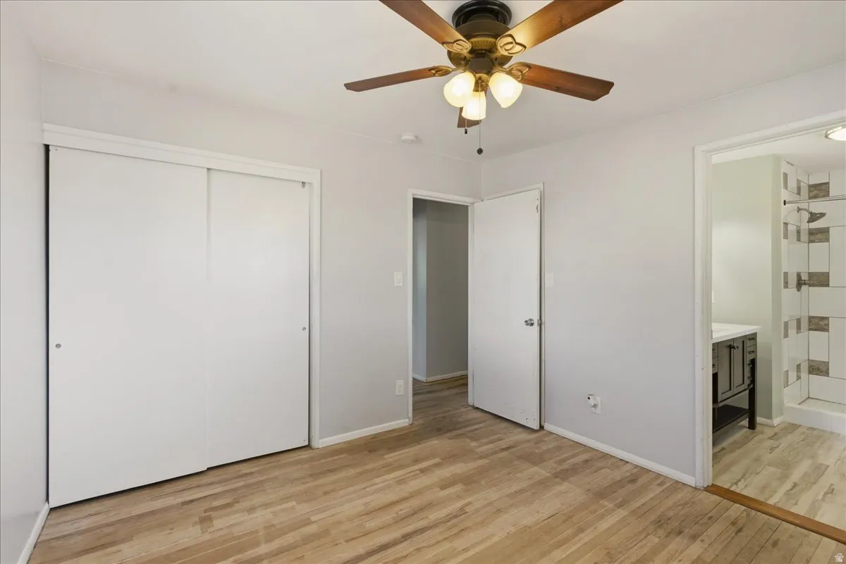 Wood-finish flooring throughout, complemented by light gray walls