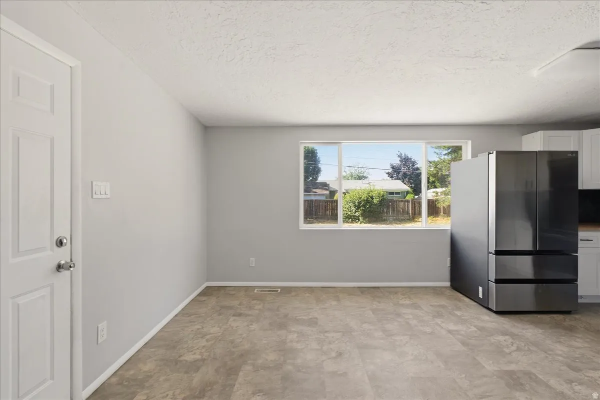 Light grey walls complement the wood-finish flooring