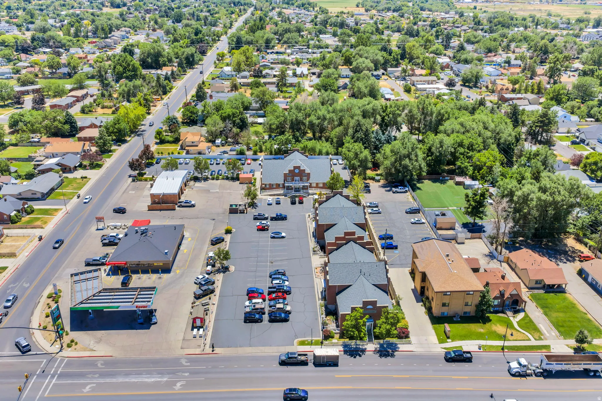 Expansive paved parking area servicing multiple commercial buildings