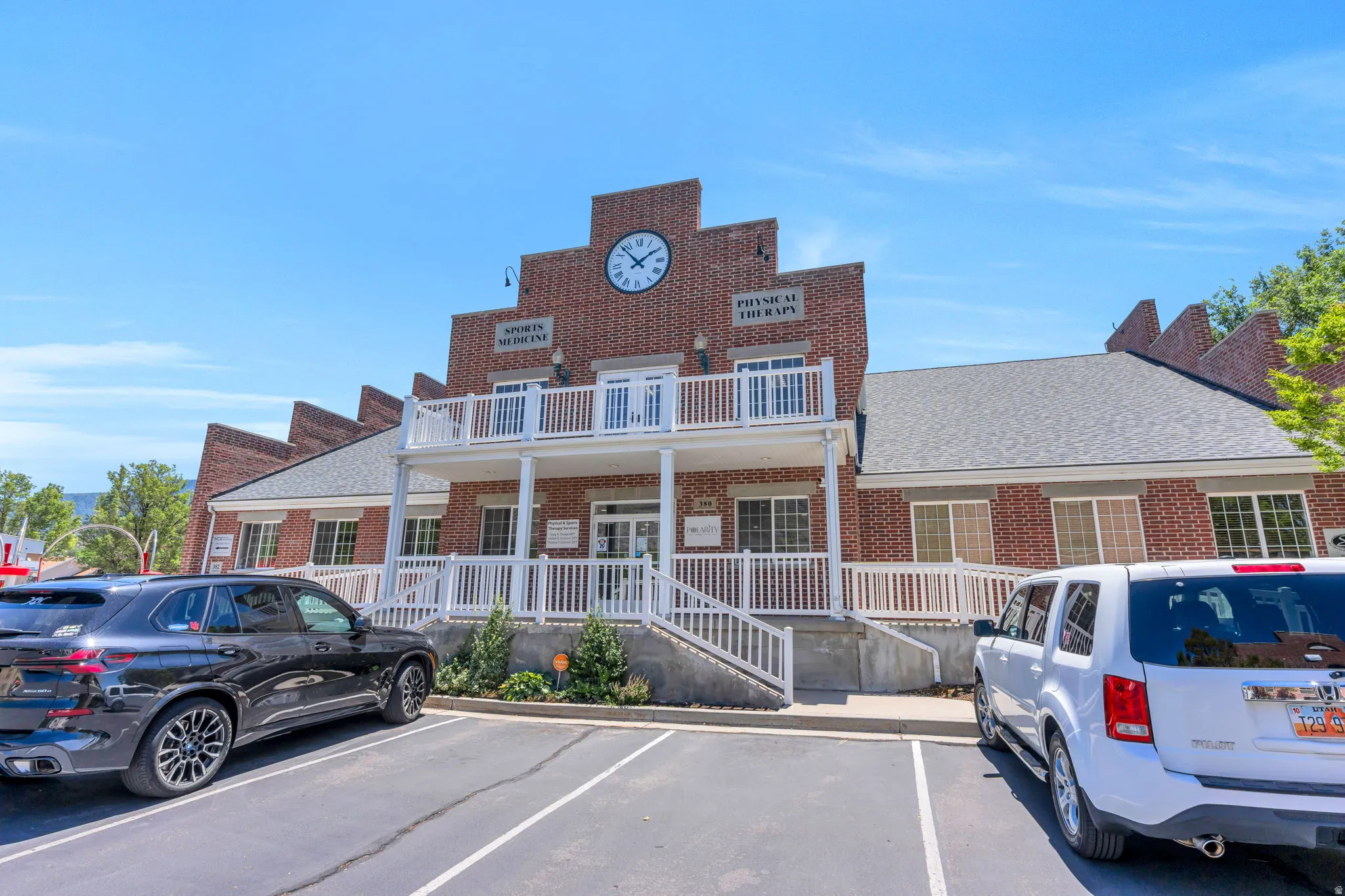 Brick facade building with a prominent clock feature