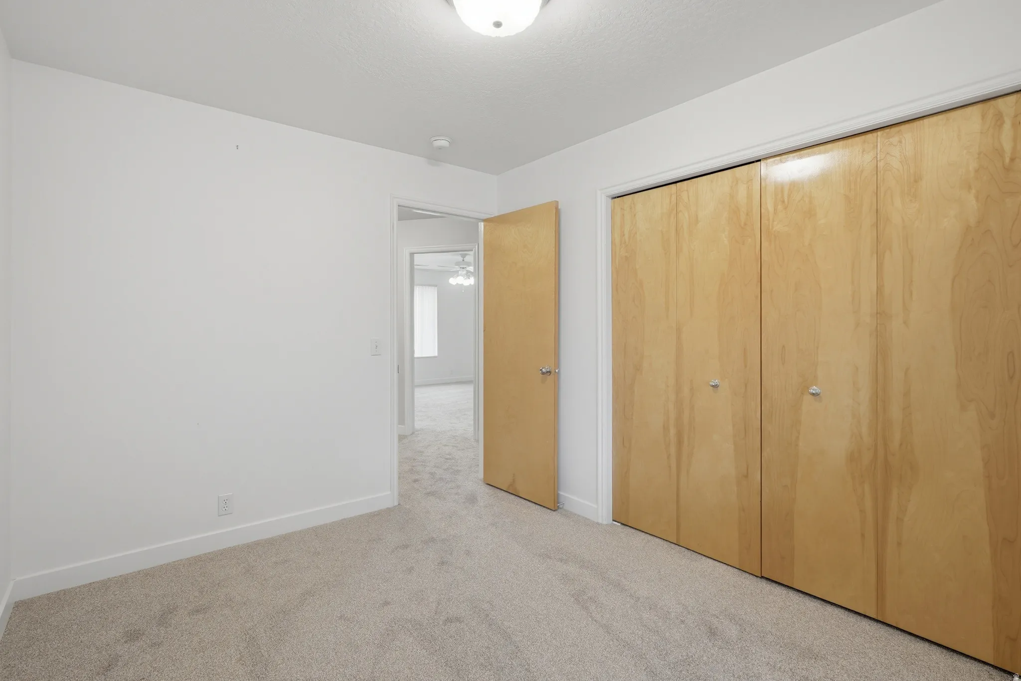 Neutral-toned carpeting throughout