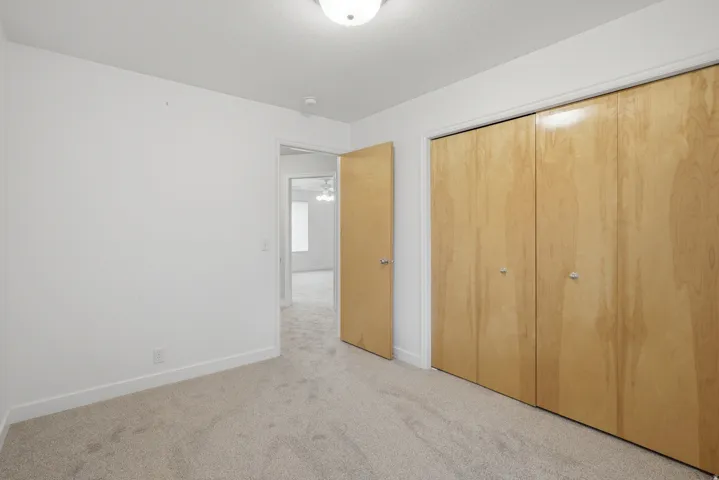 Neutral-toned carpeting throughout