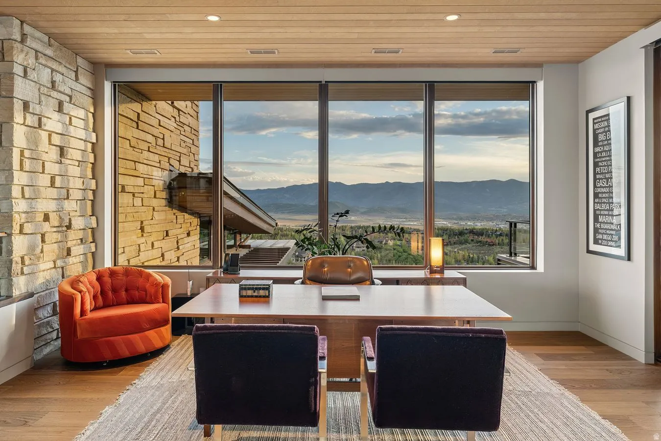 Floor-to-ceiling windows, wood-finish ceiling, stone accent wall, recessed lighting, and wood-finish flooring