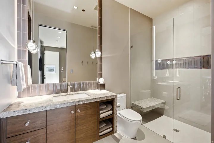 Floating vanity with a light-toned countertop and an undermount sink
