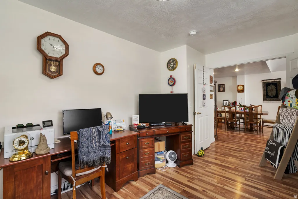 Hardwood-finish flooring throughout, complemented by light-toned wall finishes