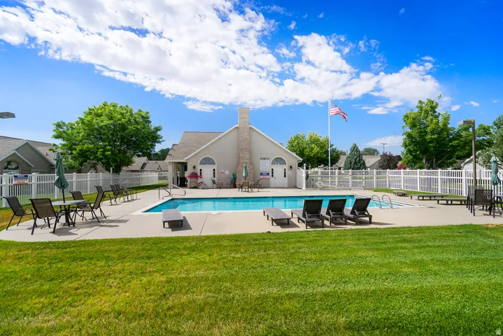 Community swimming pool with surrounding concrete deck
