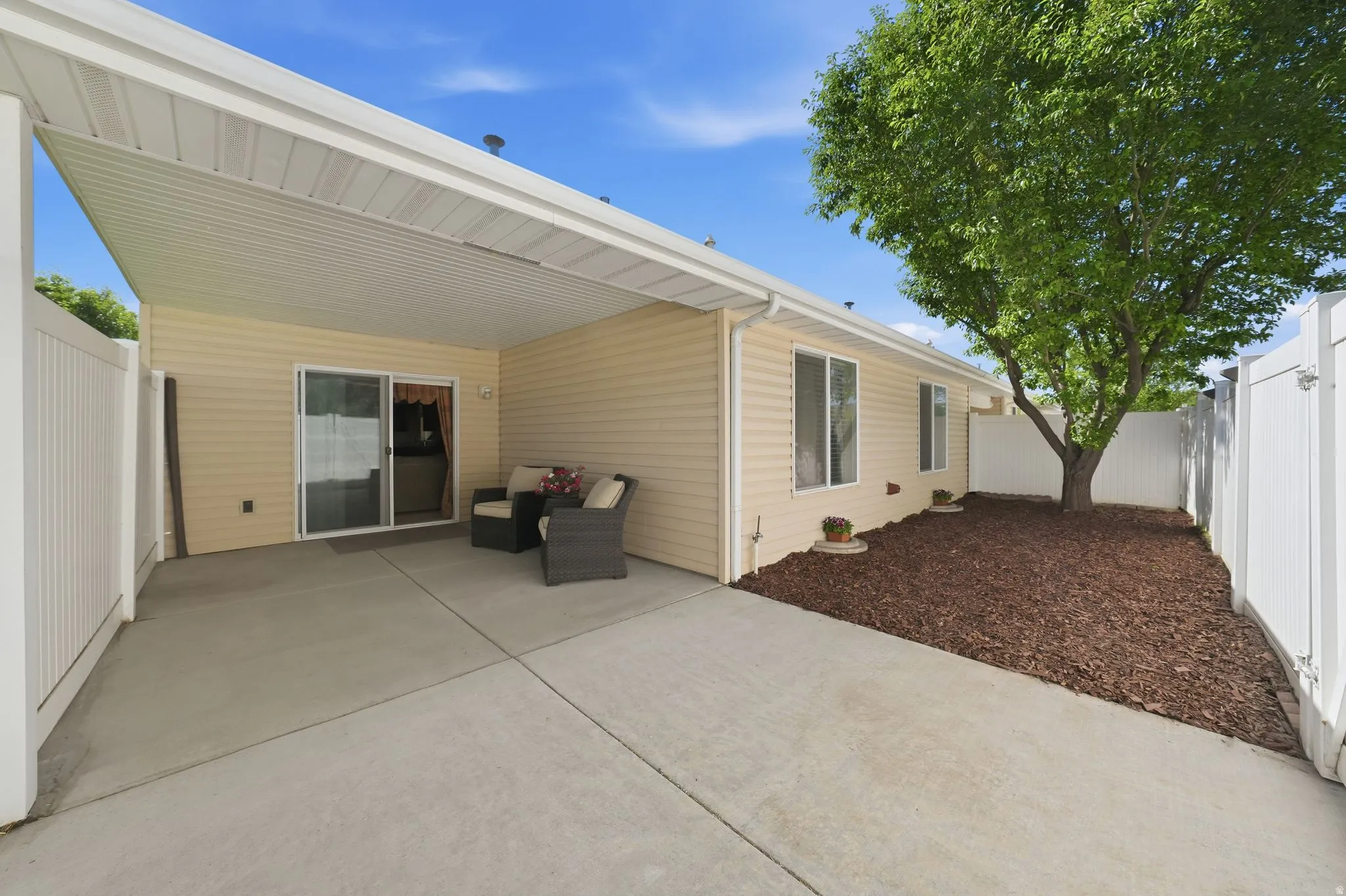 Covered concrete patio with siding exterior