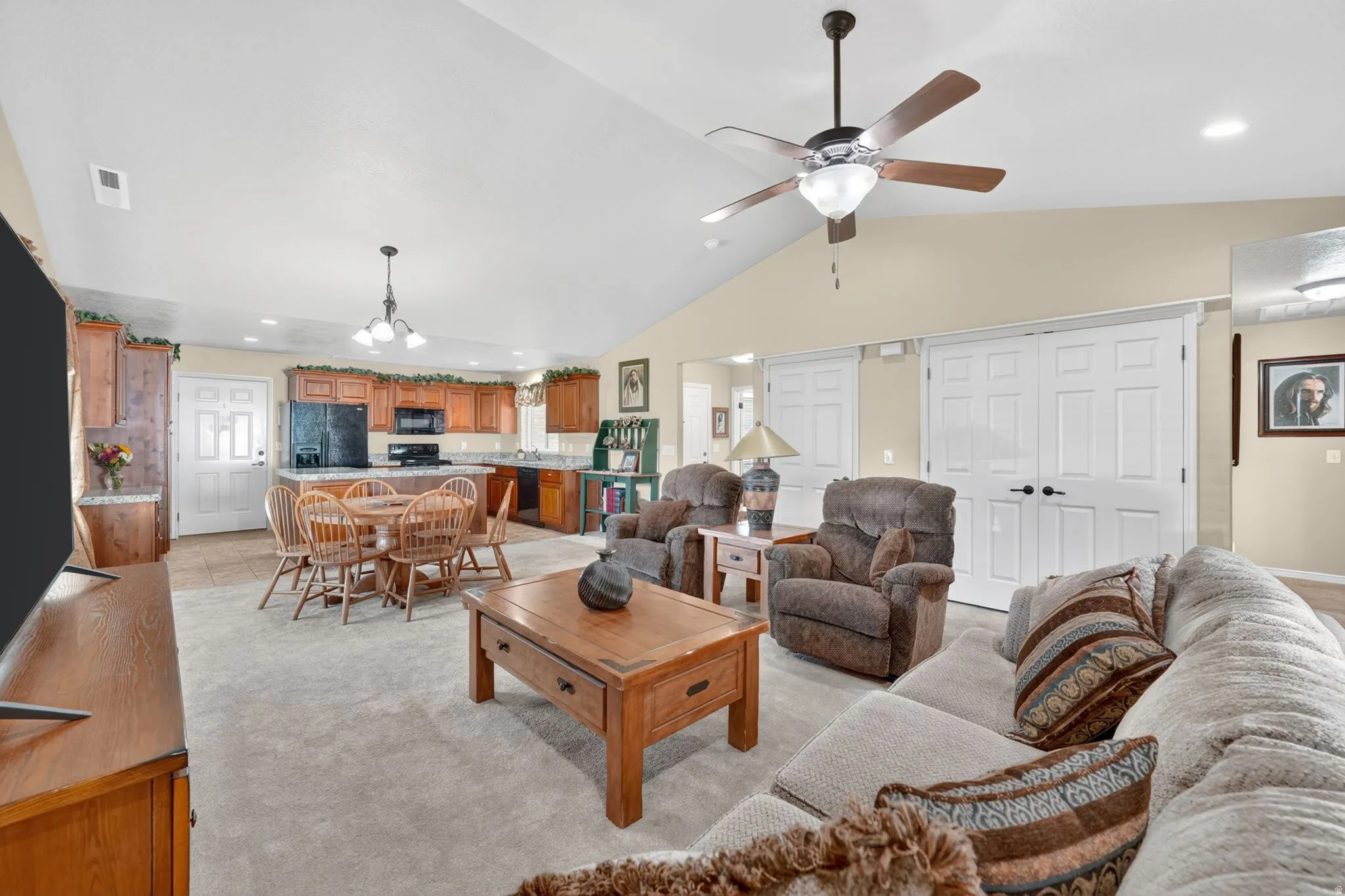 Vaulted ceilings with a ceiling fan overhead