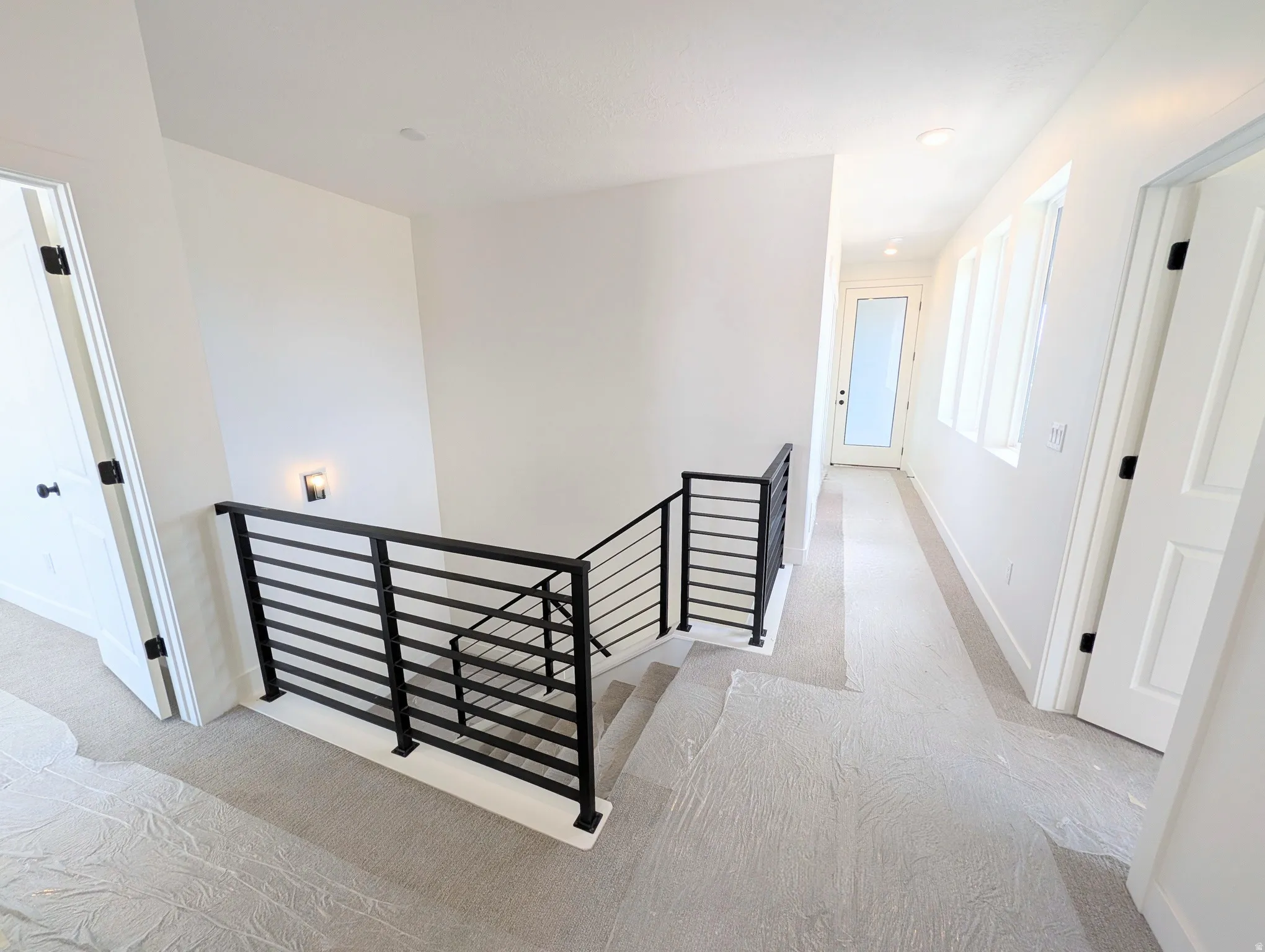 Contemporary metal railing system overlooking a staircase