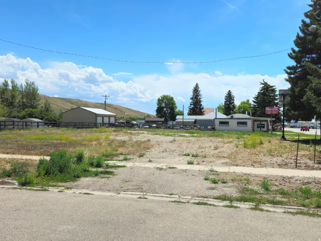 Expansive undeveloped lot with existing street-level sidewalk