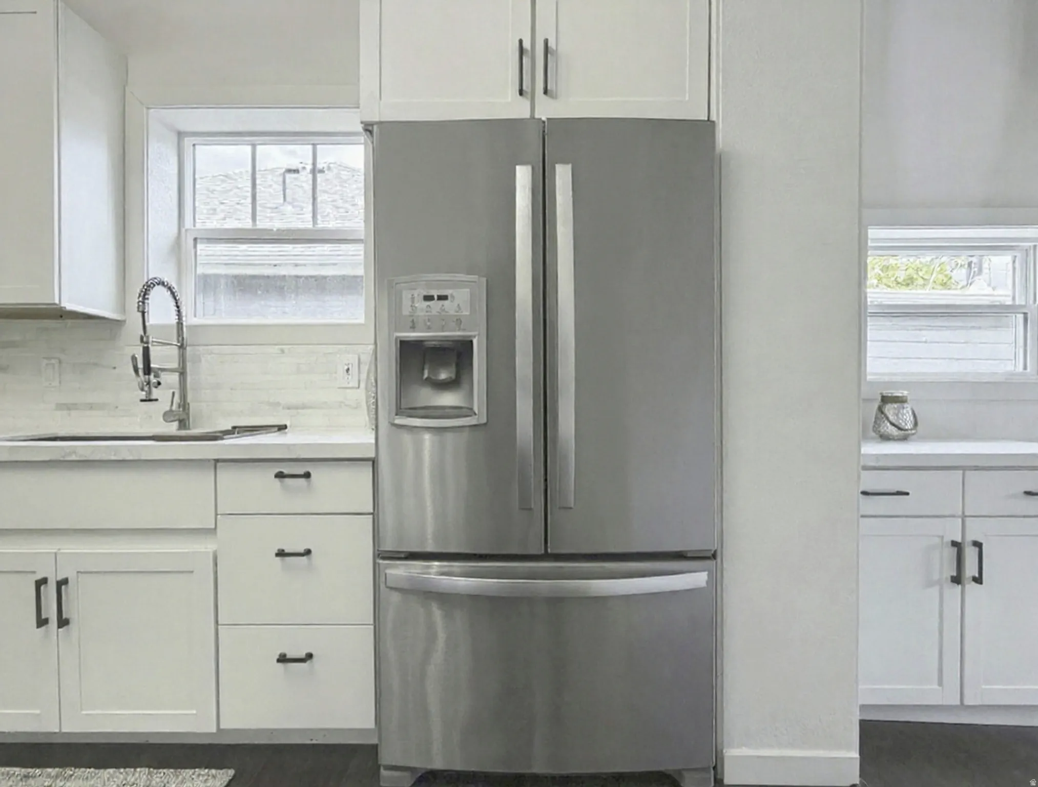 Stainless steel French door refrigerator.