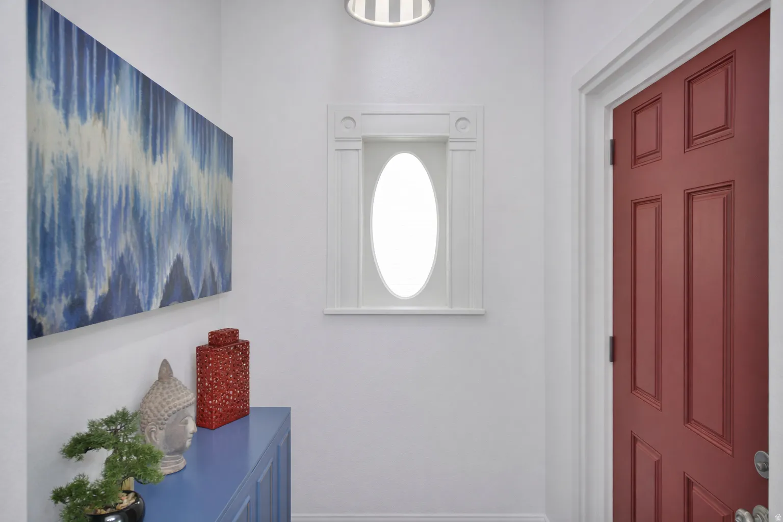 Nostalgic oval window in foyer.