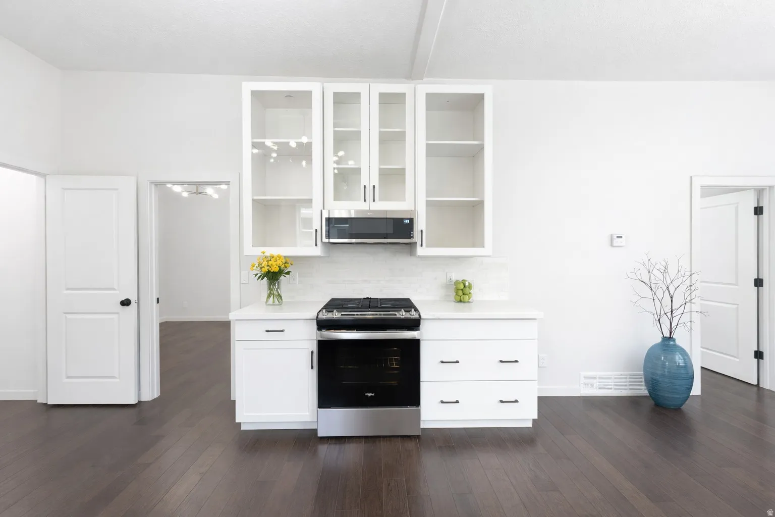 Stainless gas range and microwave for convenient gourmet style cooking.