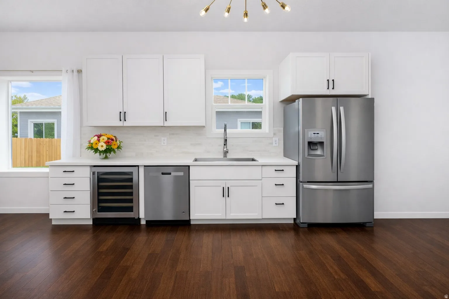 Under counter wine cooler matches stainless steel appliances.