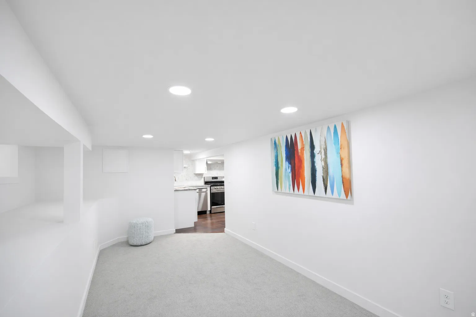 Basement family room. Basement has room 3/office/storage, recreation/family room plus full kitchen with gas stove, stainless appliances and granite countertiops.