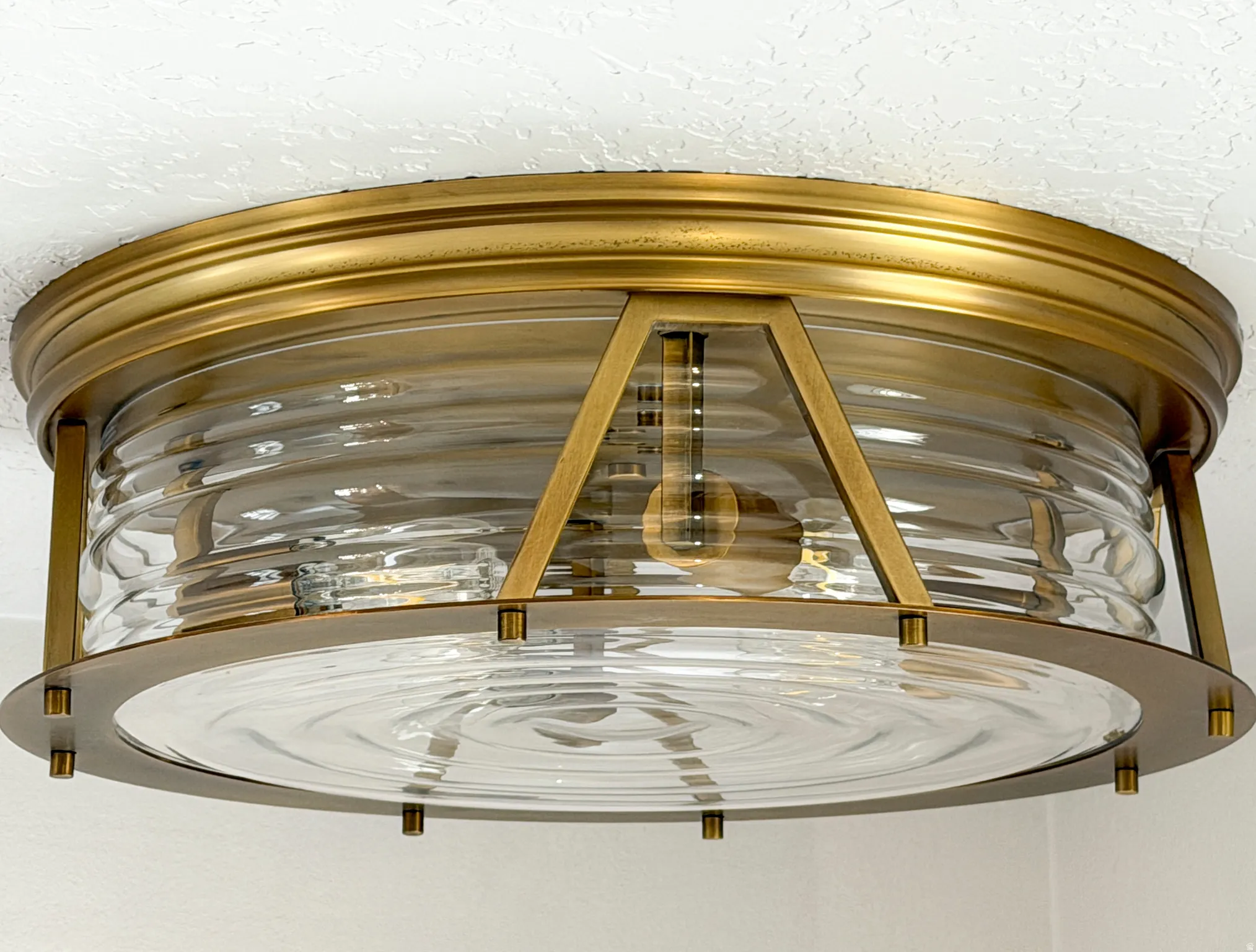 Brass with ribbed glass.