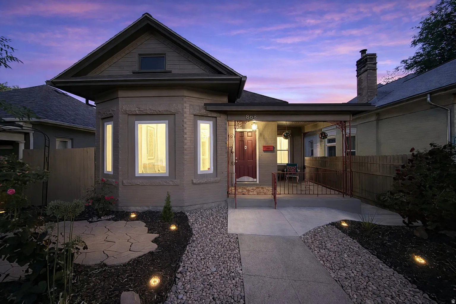 Beautiful Victorian updated in and out with peaceful, xeriscaped, zen-garden and yard with accent lighting.