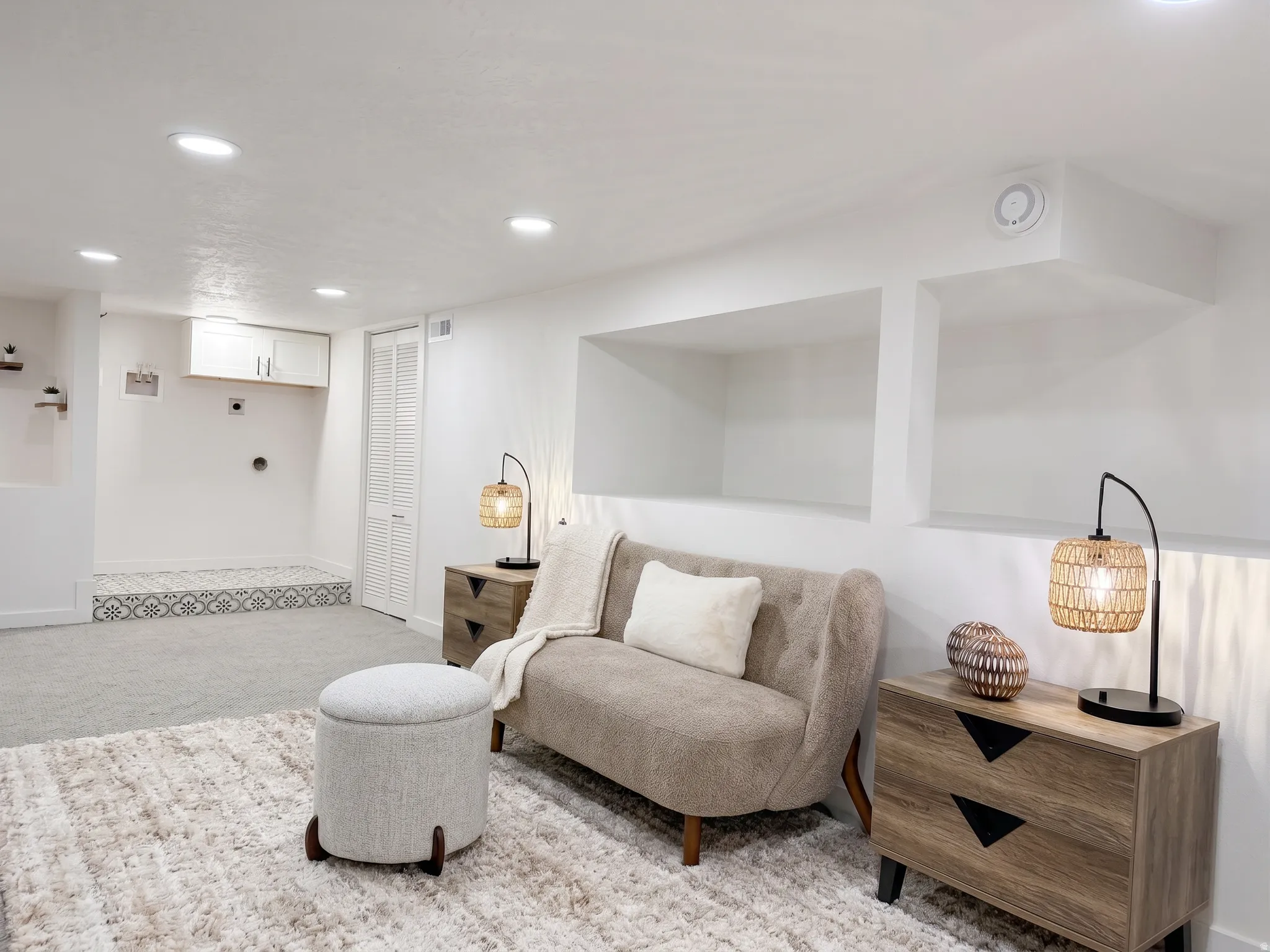 Fully-remodeled lower level with 6'2" ceilings, recessed lighting, built-in wall shelving and its own laundry area.