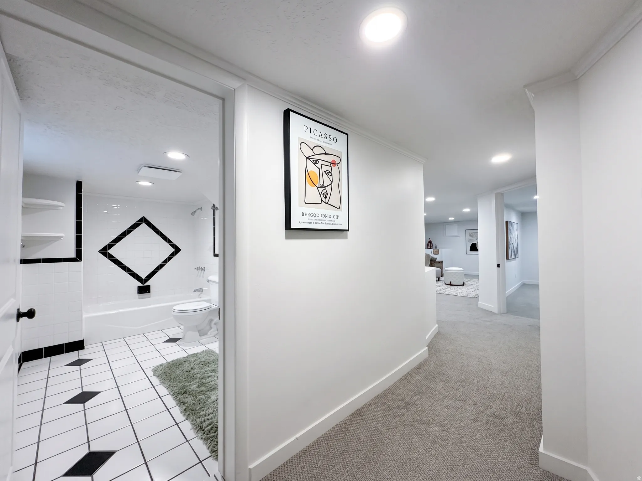 Inviting lower-level features full amenites including bathroom, kitchen, family room and flex-space room with a closet and window.