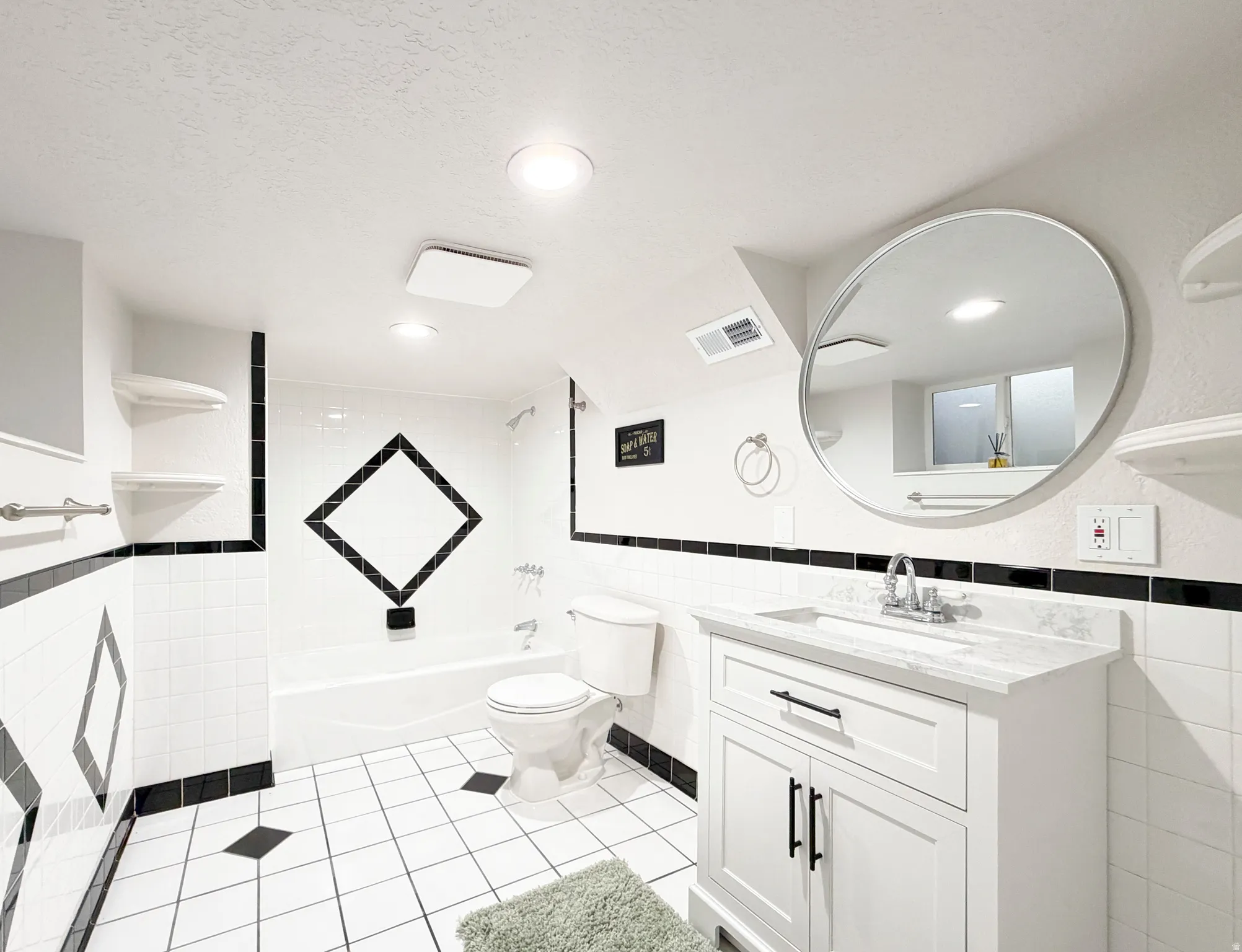 The fourth bathroom is on the lower-level and features a combo-shower-tub, and full fixtures.