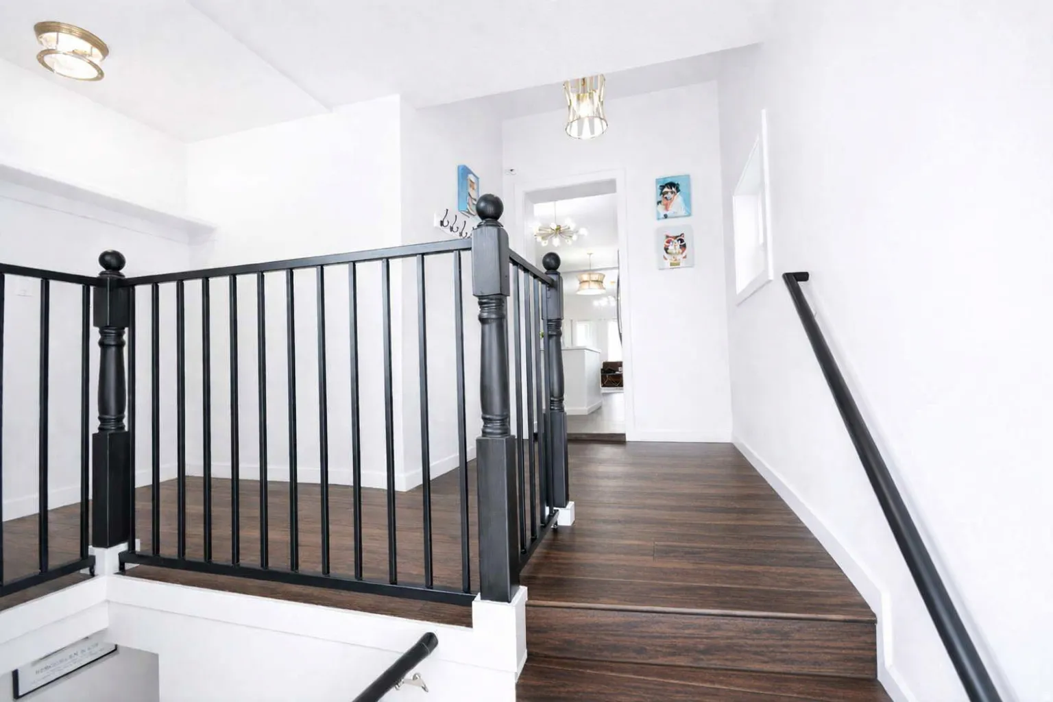 Spacious stair landing on main floor with main floor laundry.