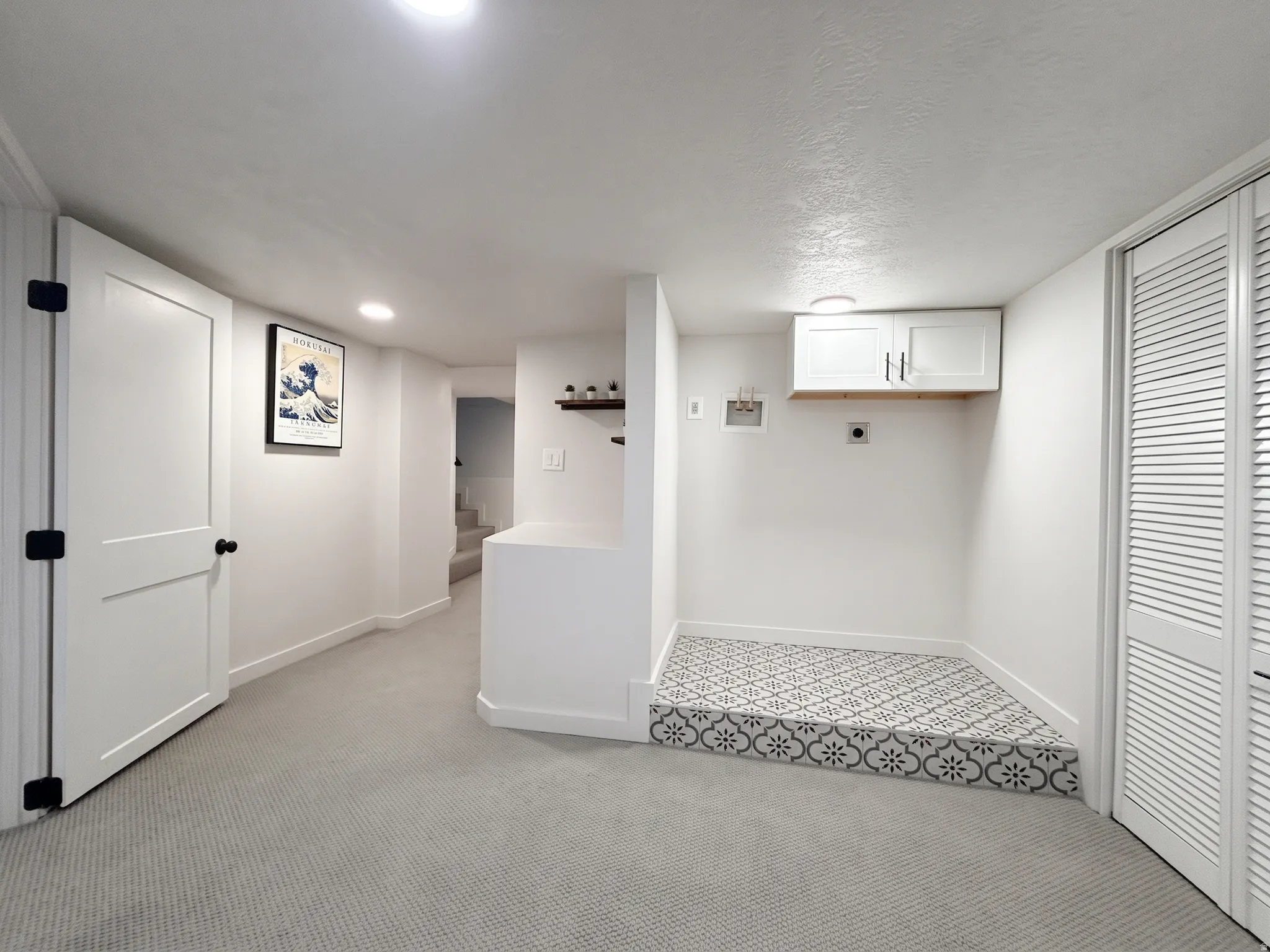Lower level  laundry area. Home offers two laundry rooms with full hookups.