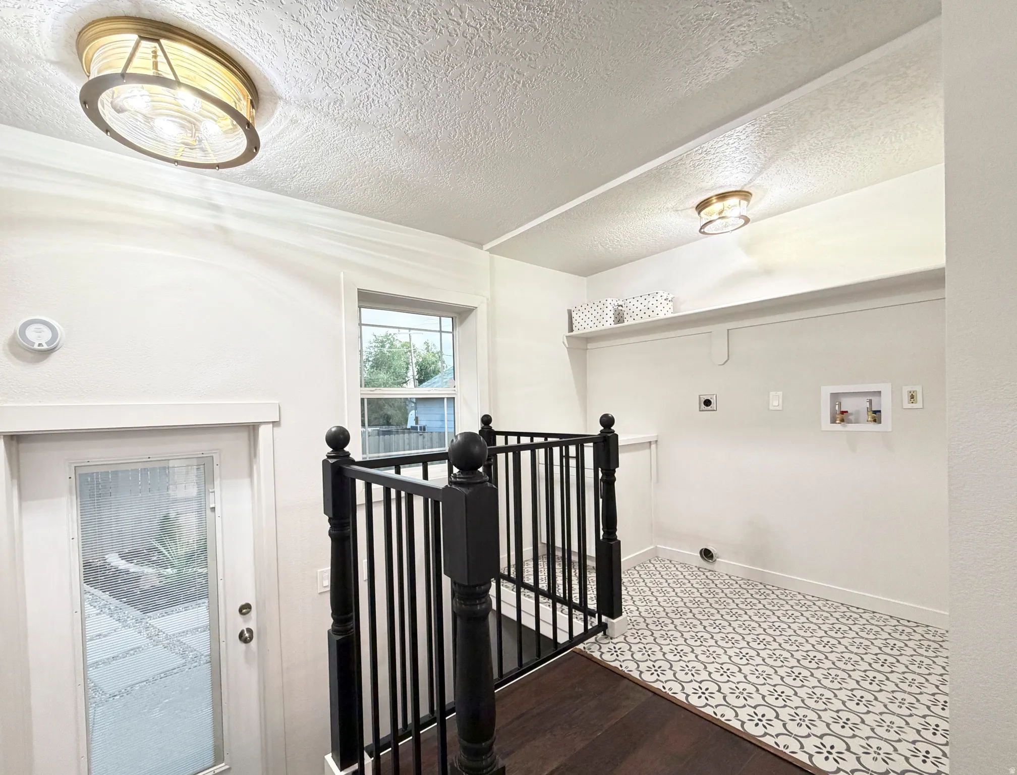 Convenient laundry area with mud room.