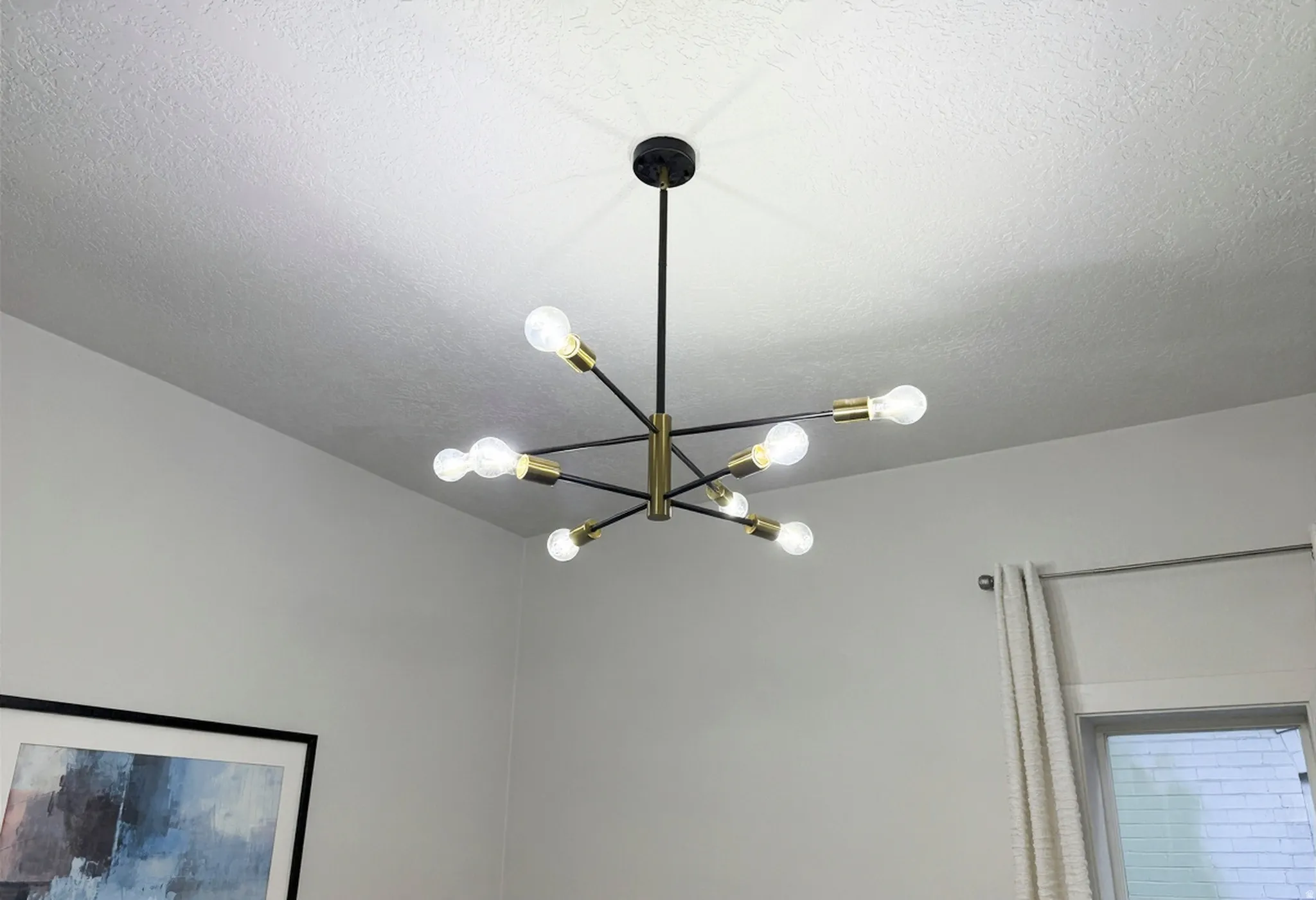 Multi-arm chandelier with brass finish