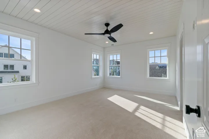 White shiplap ceiling featuring recessed lighting and a ceiling fan