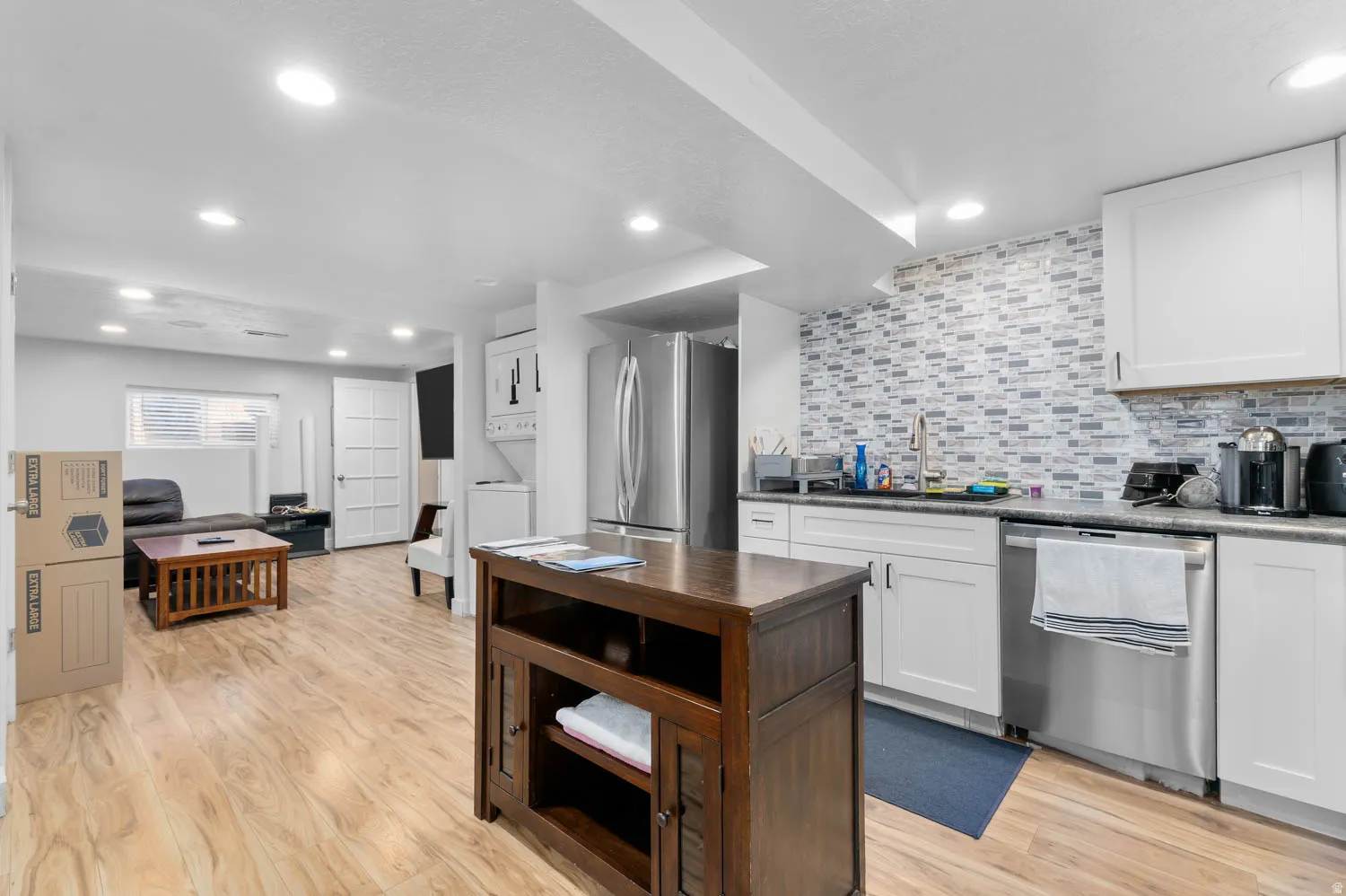 Open concept living area featuring wood-finish flooring