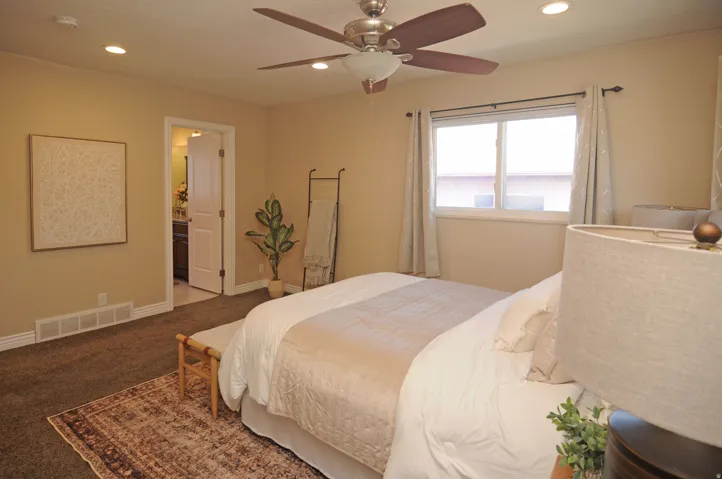 Recessed ceiling lighting, ceiling fan, and carpeted flooring